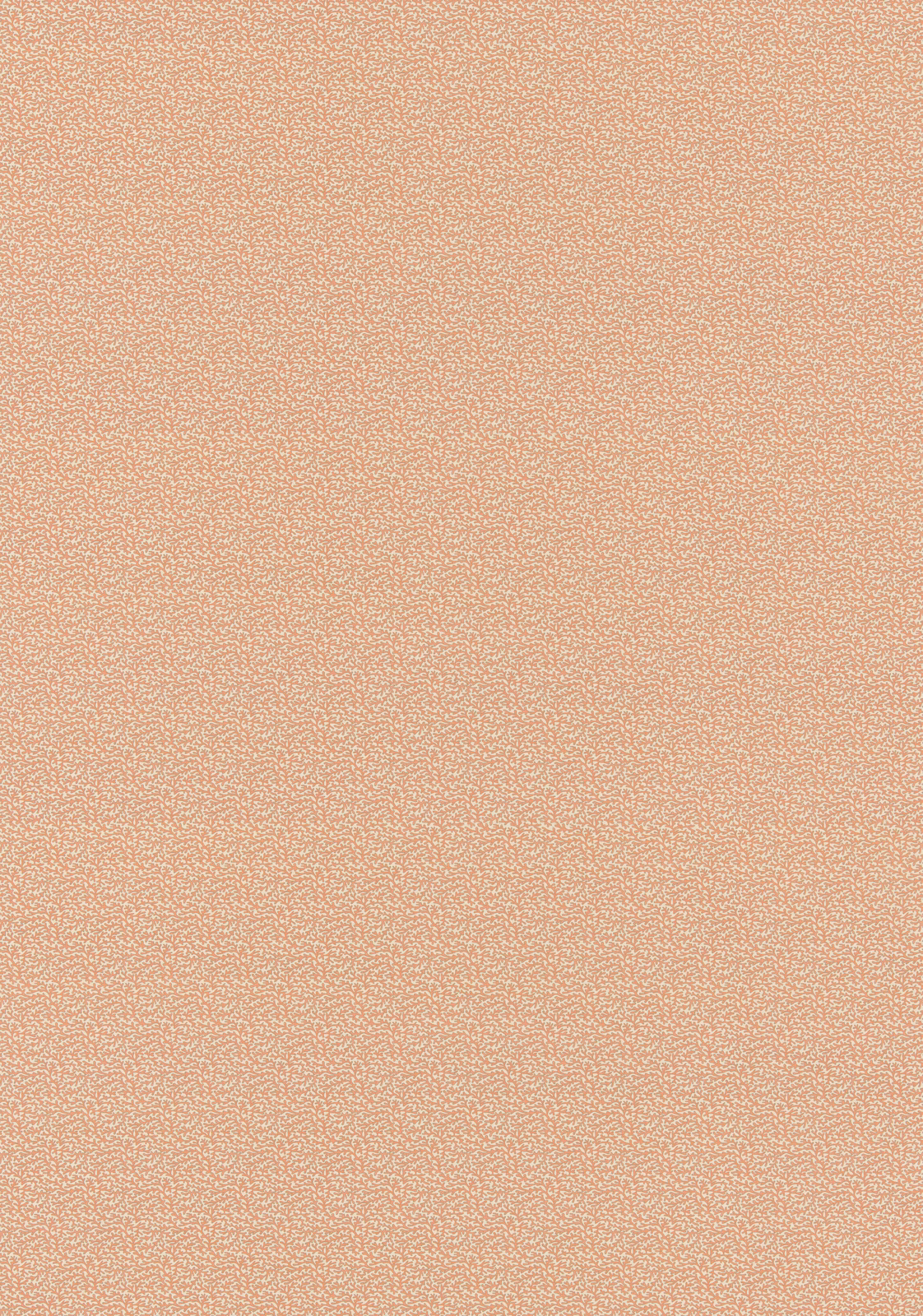 Close view of soft coral-red cotton with a minute pale all-over pattern