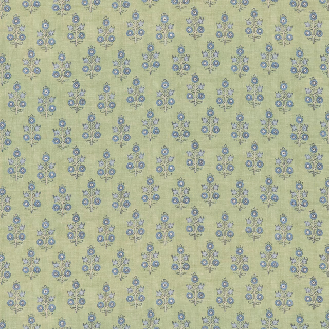 Sage green textile with repeating blue floral sprigs and fine woven texture