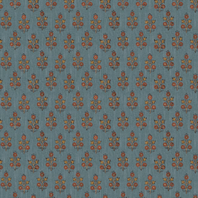 Muted denim-blue wallpaper with rust and ochre floral sprigs in a small repeat