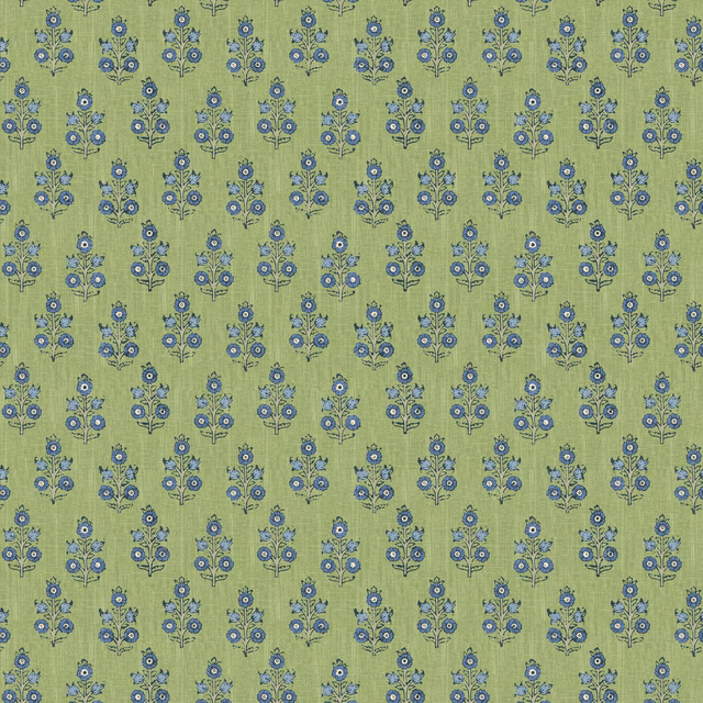 Muted green wallpaper with repeated blue floral sprigs and a softly mottled ground