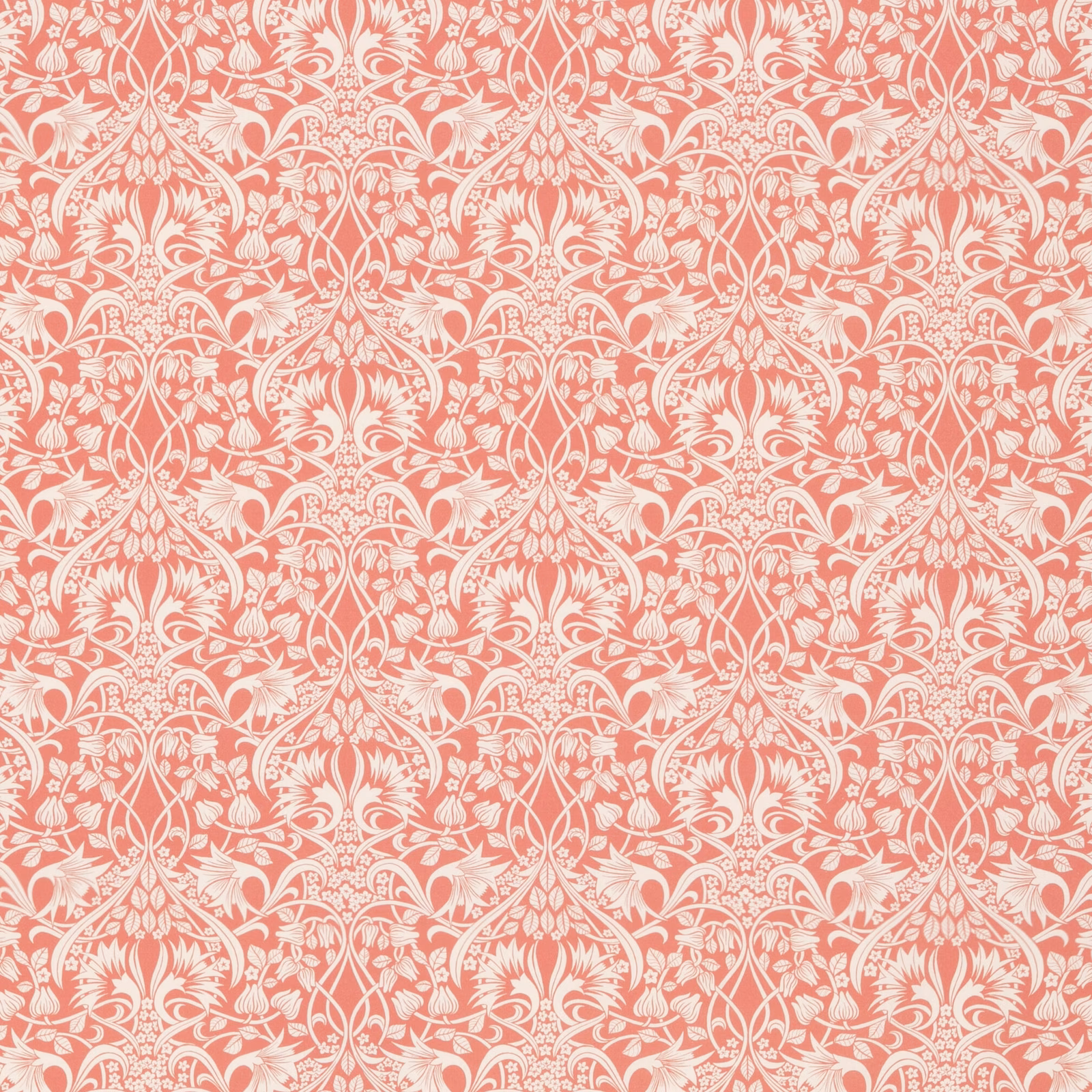 Warm coral cotton with ivory scrolling damask and symmetrical floral motifs