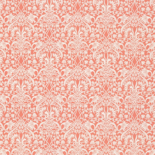 Warm coral cotton with ivory scrolling damask and symmetrical floral motifs