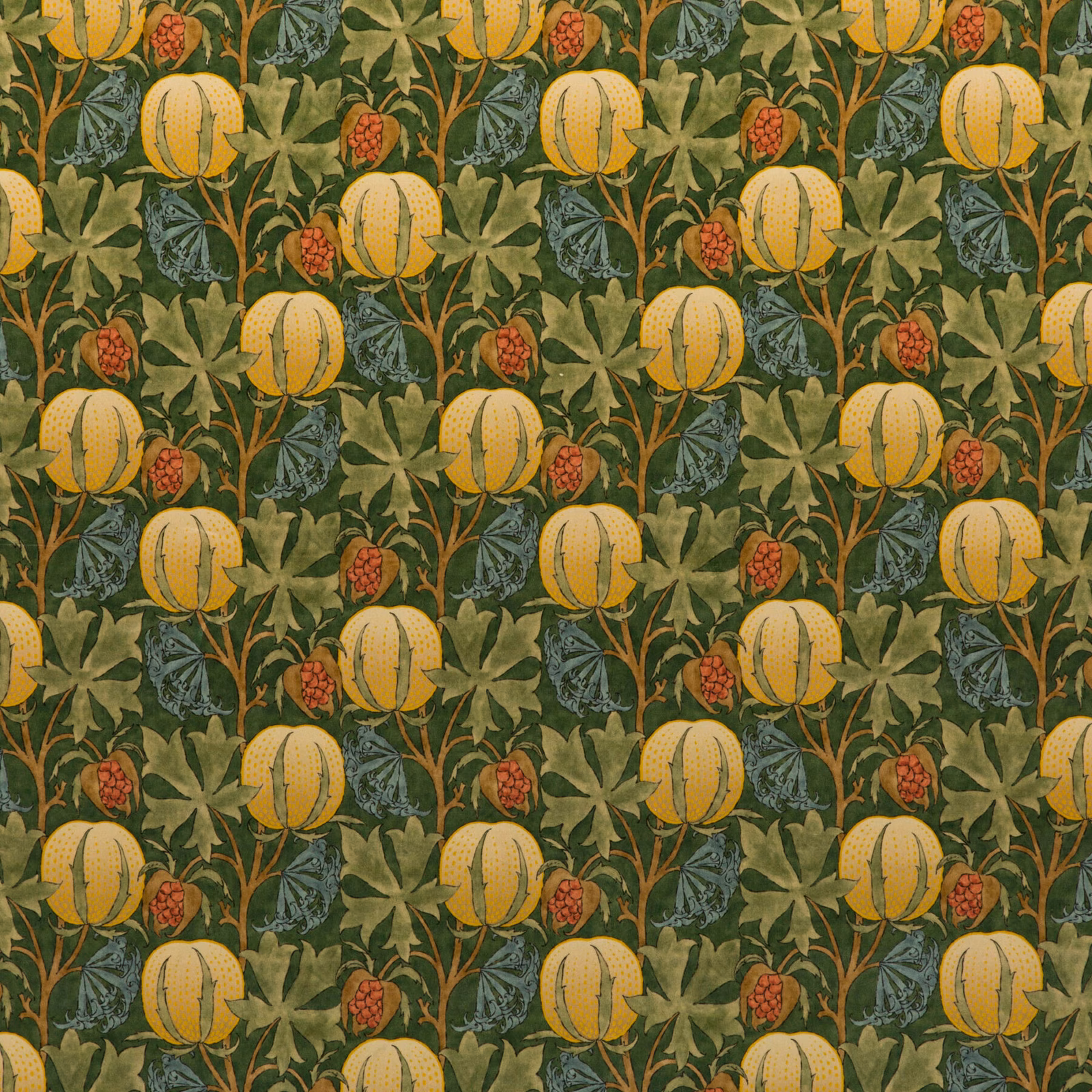 Moss green velvet with ochre pumpkins, terracotta berries and dense leafy botanical repeat