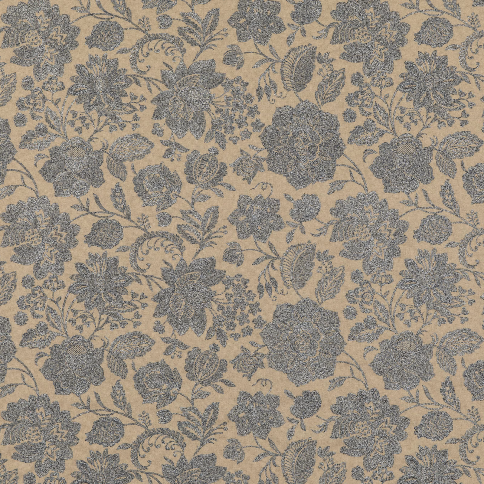 Muted blue-grey floral damask motifs on a warm beige ground, close-up