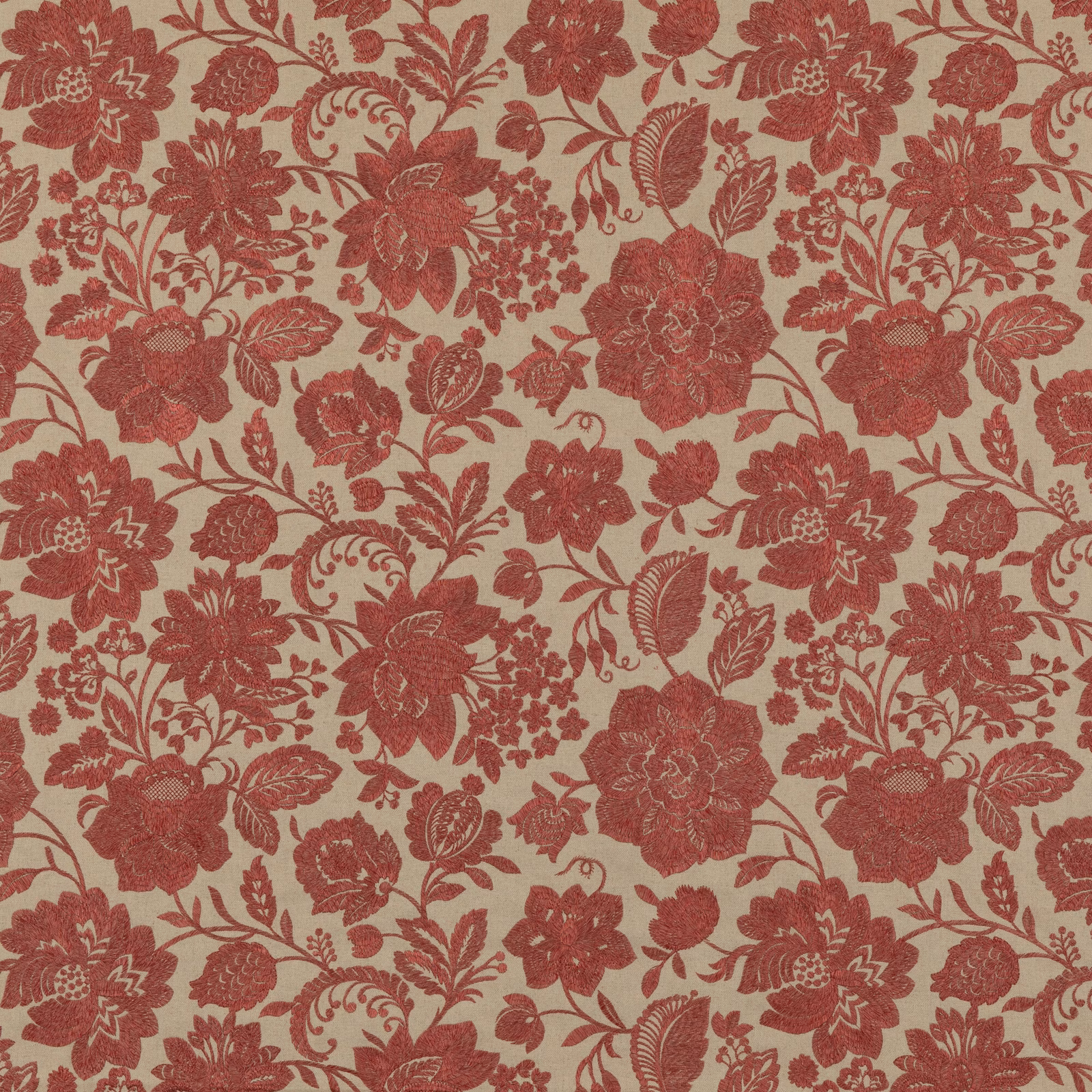 Muted brick-red floral sprays and scrolling leaves on a warm beige woven ground