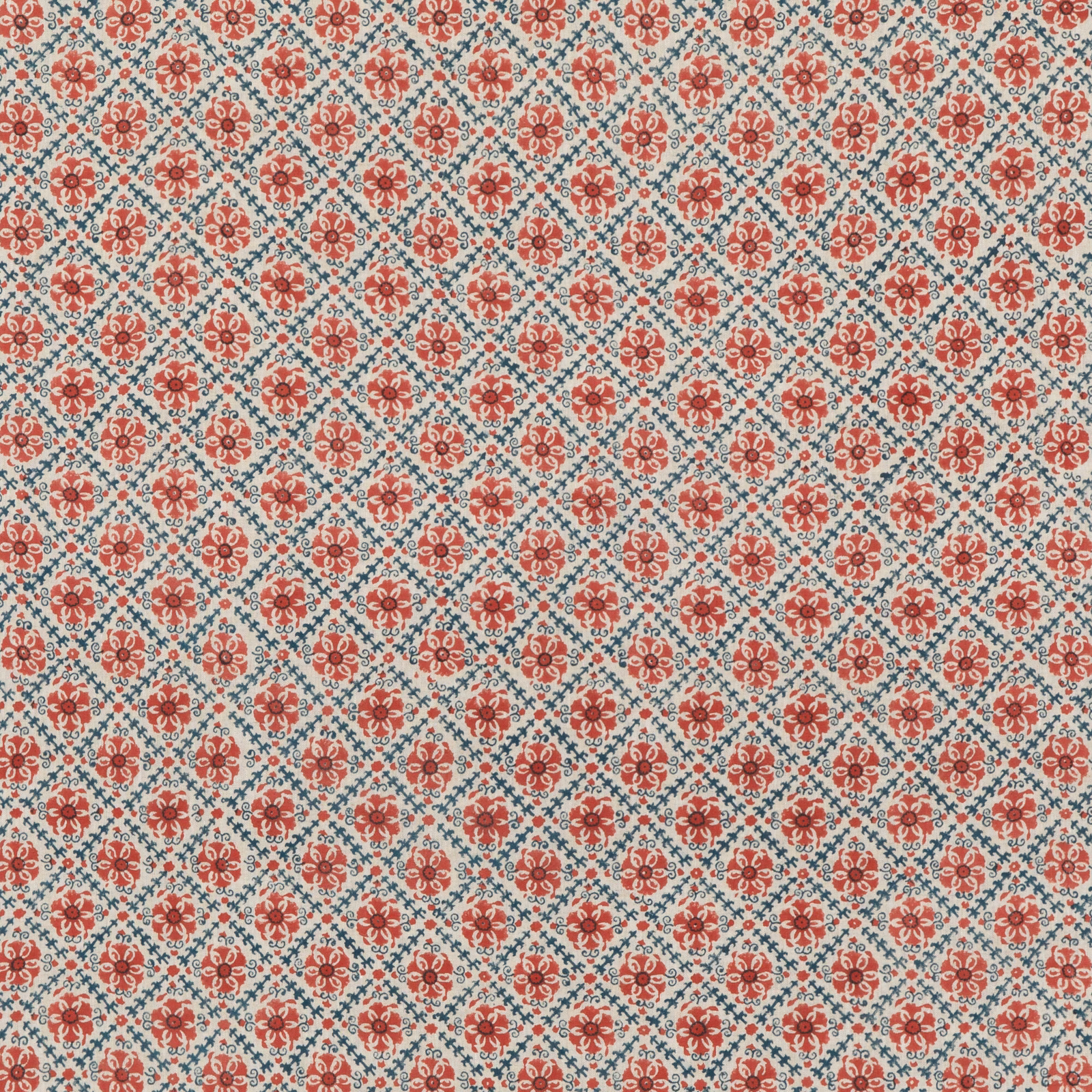Brick-red floral medallions and blue trellis on textured ivory linen