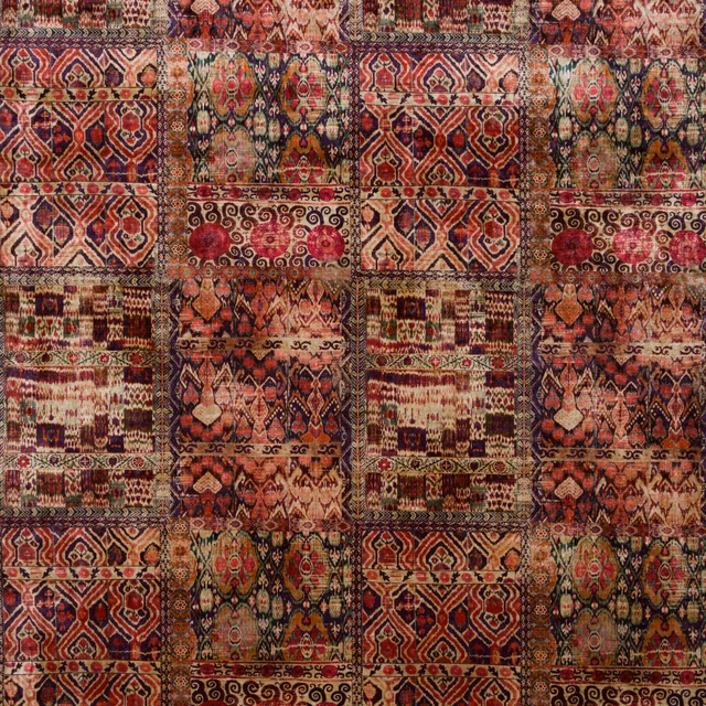 Close view of Rio Magenta velvet with burgundy, rose and olive geometric panels