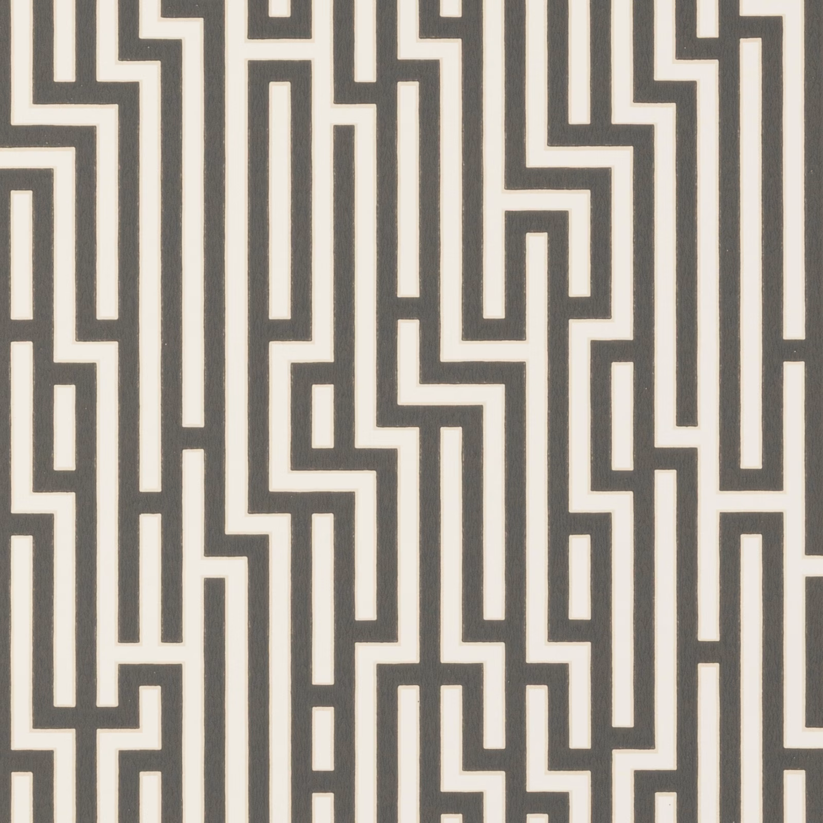 Charcoal and ivory interlocking fretwork wallpaper with angular maze-like lines