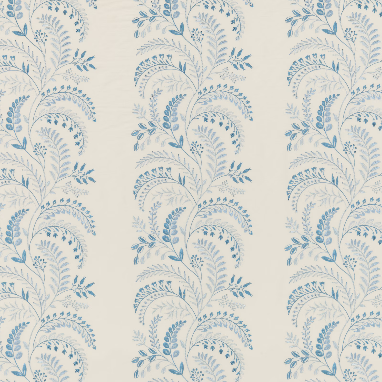 Soft blue scrolling botanical stems and leaves on a pale ivory fabric ground