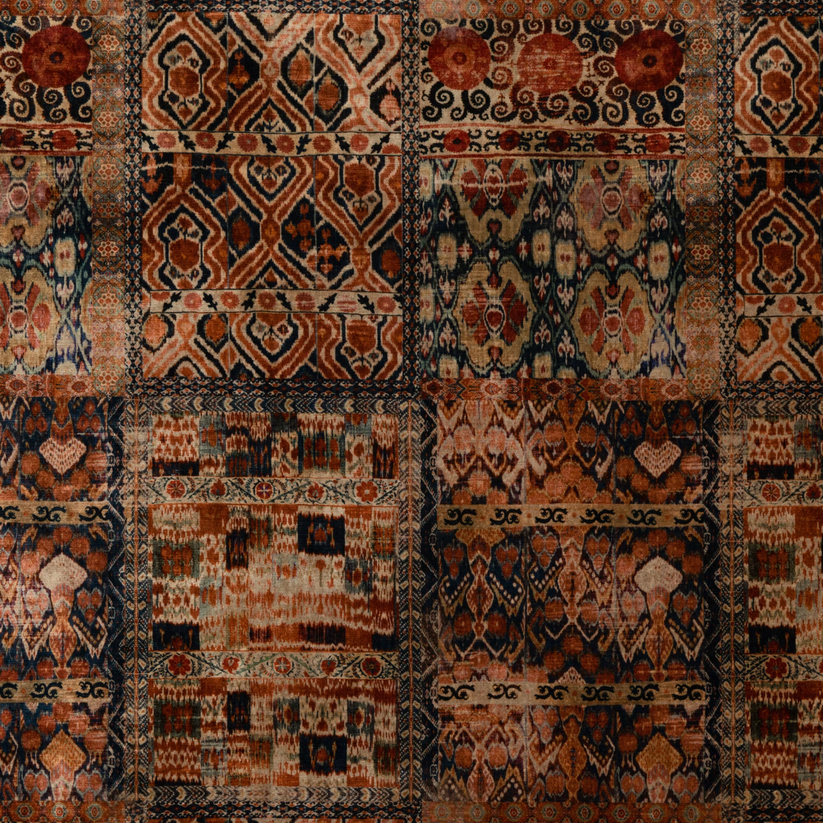 Sienna velvet patchwork in rust, charcoal, cream and muted teal with geometric motifs