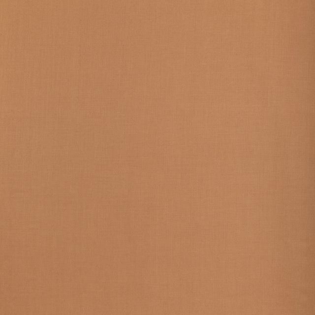 Warm nutmeg terracotta linen swatch showing a subtle plain woven texture
