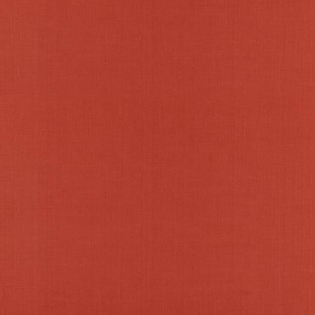 Close-up of warm Tuscan red linen showing fine vertical slub texture