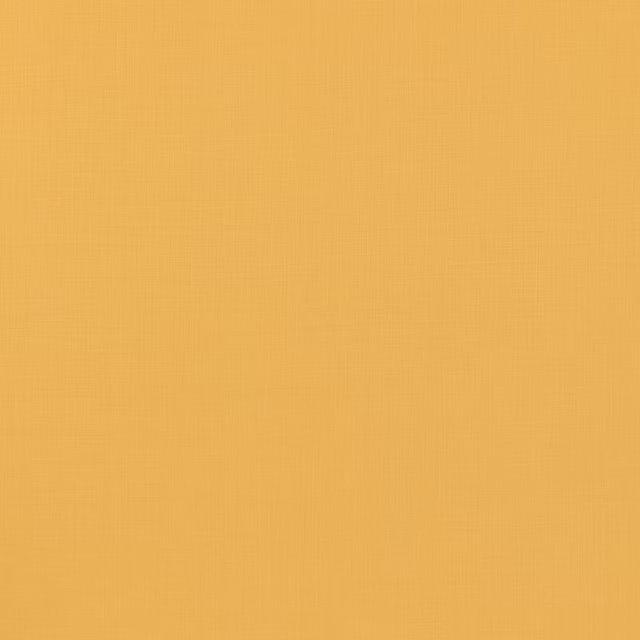 Close-up of warm golden-yellow linen with fine vertical weave and subtle slub texture
