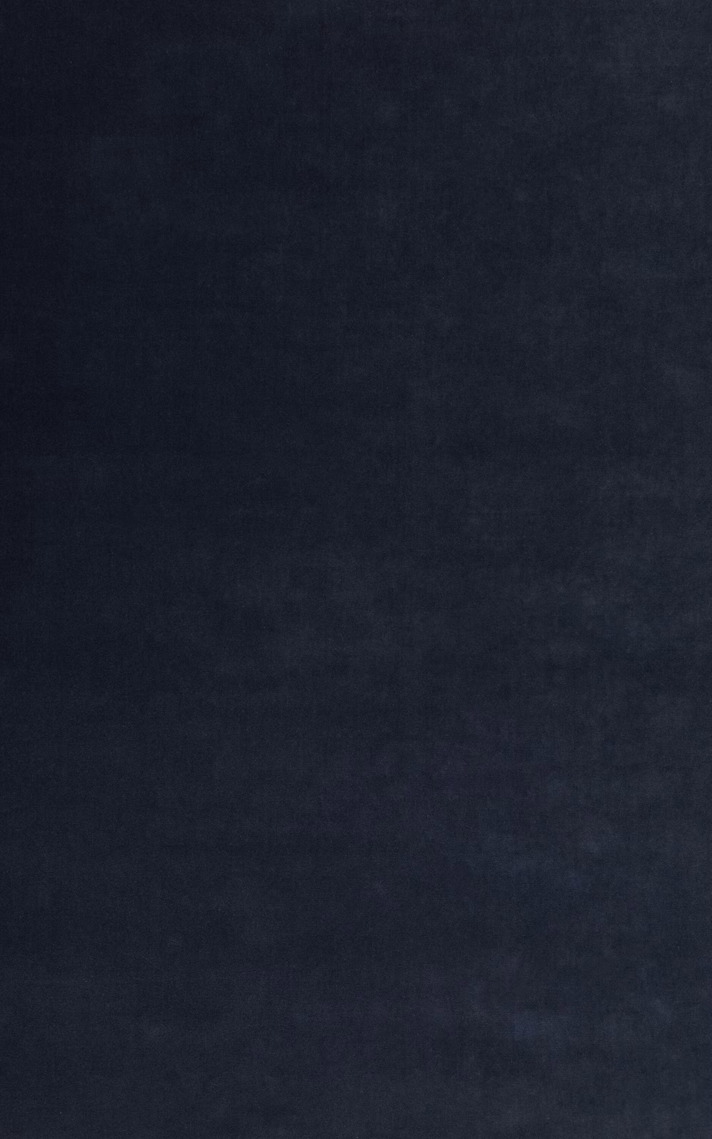 Inky navy velvet with a softly mottled pile and subtle blue shading