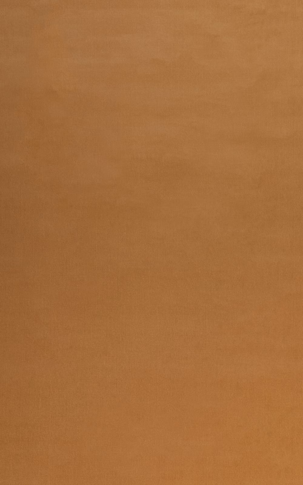Warm camel velvet with a smooth, subtly directional pile and soft tonal shading