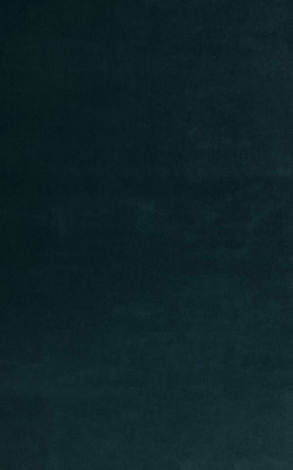 Deep peacock teal velvet with subtle nap shading and a softly mottled surface