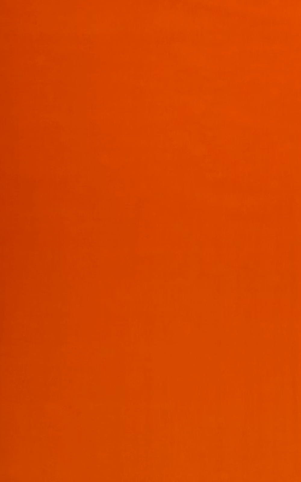 Warm pumpkin-orange velvet showing a softly directional nap and subtle tonal shading