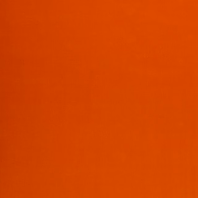 Warm pumpkin-orange velvet showing a softly directional nap and subtle tonal shading