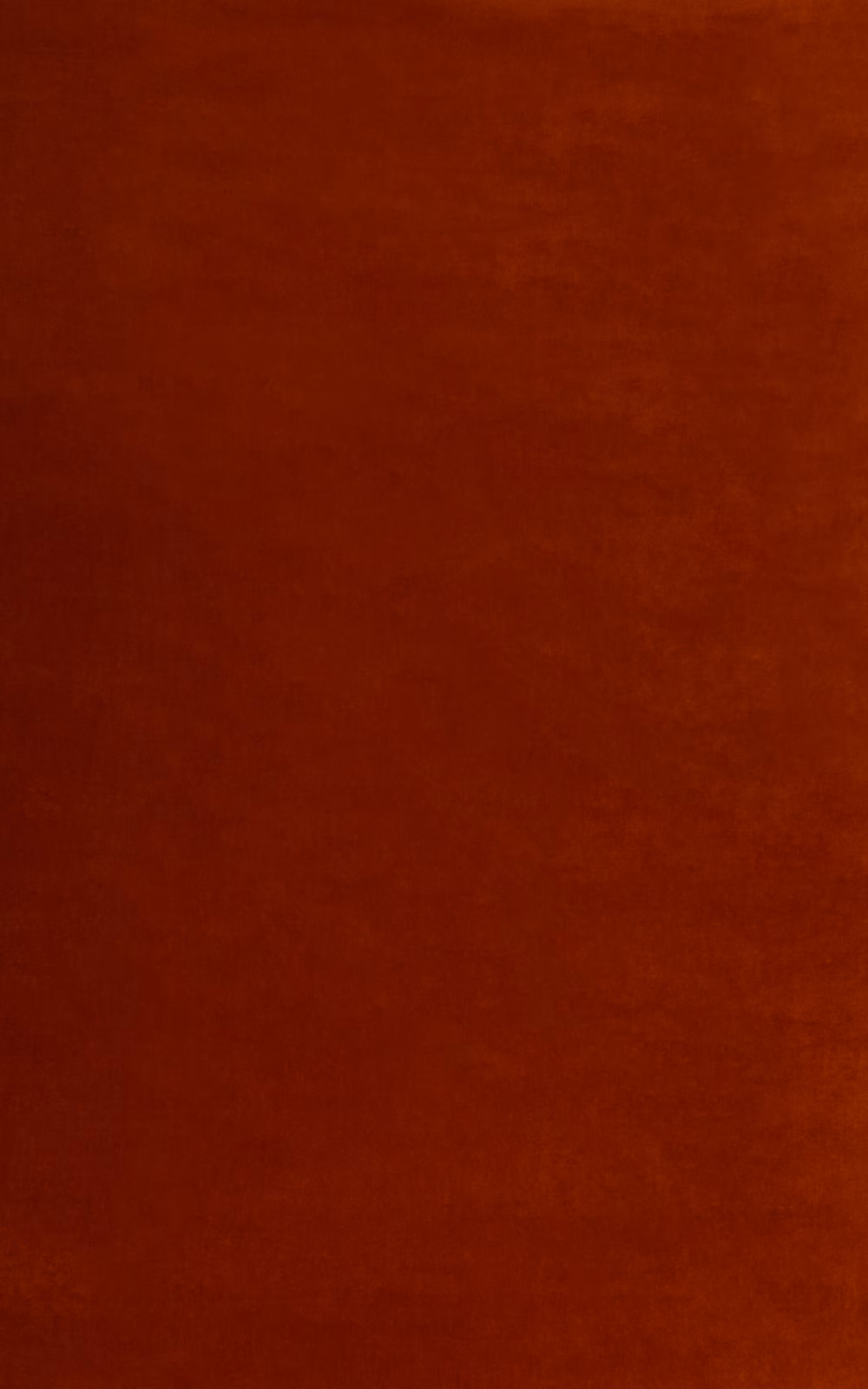 Deep spice-red velvet with a softly shaded, directional nap