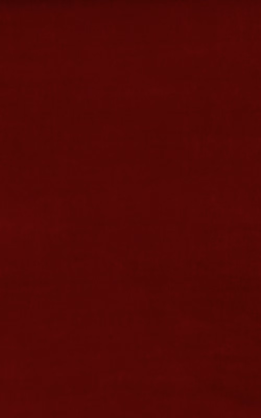 Deep Tuscan red velvet with subtle nap variation and a softly shaded surface
