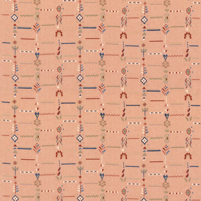 Dusty rose woven ground with blue, rust and cream geometric motifs