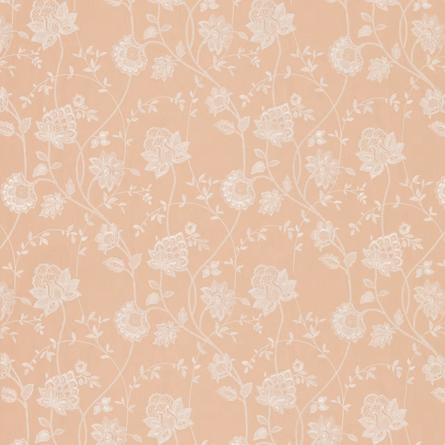Warm blush-peach floral fabric with delicate ivory trailing stems and blossoms