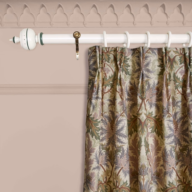 Ecru botanical curtain with olive, brown, mauve and blue-grey foliage in soft folds
