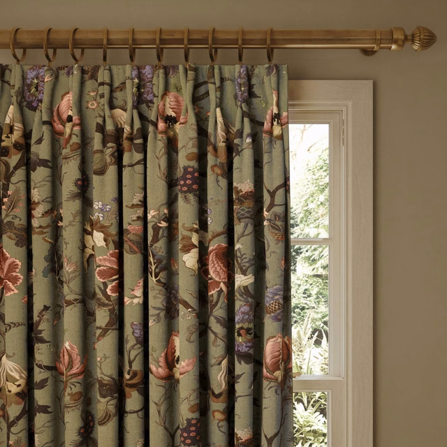 Pleated jadeite green curtain with blush, plum and cream botanical blooms