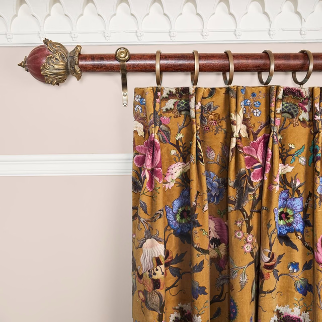 Gathered bronze velvet curtain with pink, blue and cream floral motifs