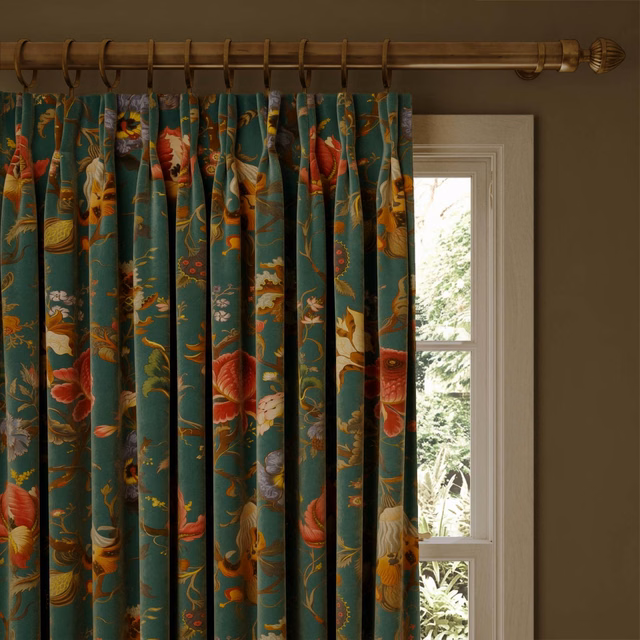 Petrol teal velvet curtain with colourful oversized flowers and trailing botanical motifs
