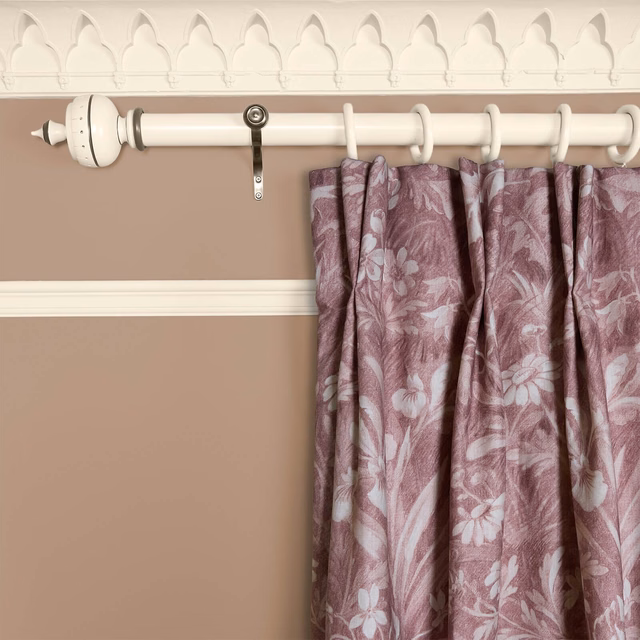 Dusty mauve floral curtain with pale blue-grey blossoms and leafy woven texture