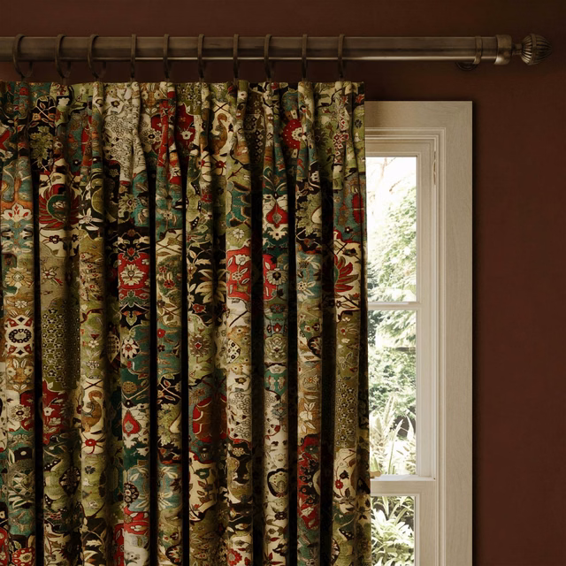 Deep forest velvet curtains with ornate red, cream and gold botanical motifs