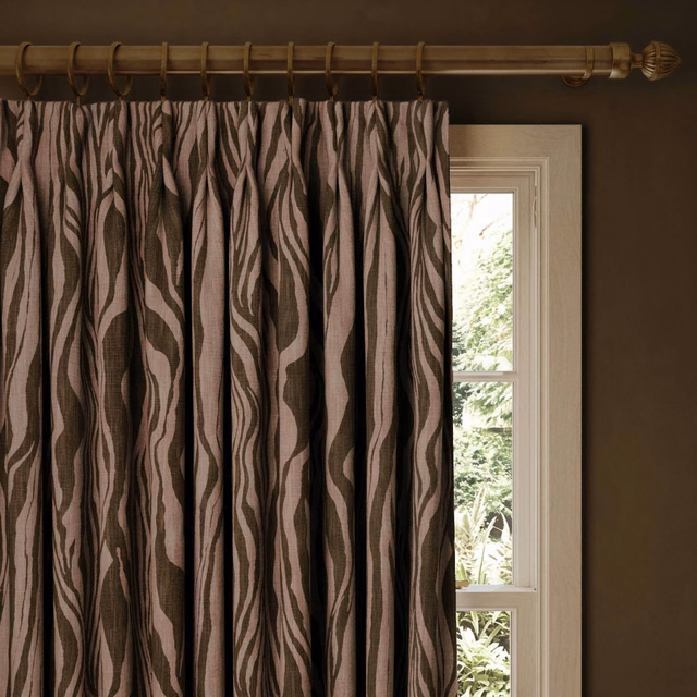 Full-length Cosmos curtains with dusty mauve waves on a deep brown ground