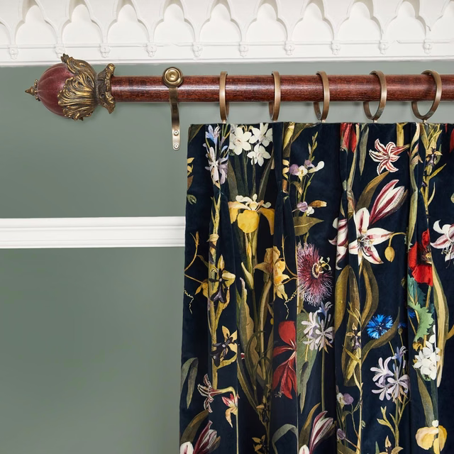 Midnight navy velvet curtain with colourful painterly flowers and vertical folds