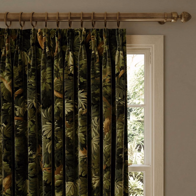 Pleated Noir velvet curtain with olive botanical leaves and ochre accents