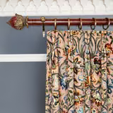 Blush velvet curtain with scrolling foliage, jewel-toned flowers, and soft pile sheen