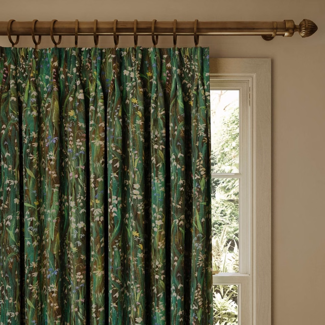 Gathered deep green botanical curtain with cream, lilac and ochre floral details