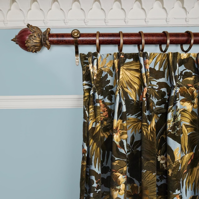 Sky-blue floral velvet with dark foliage, gold leaves and warm botanical highlights