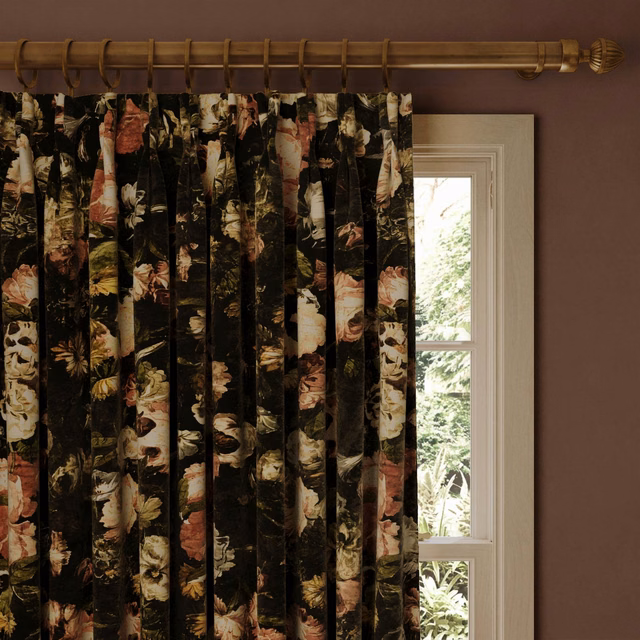 Black velvet curtains with painterly cream, rose, green and ochre floral blooms