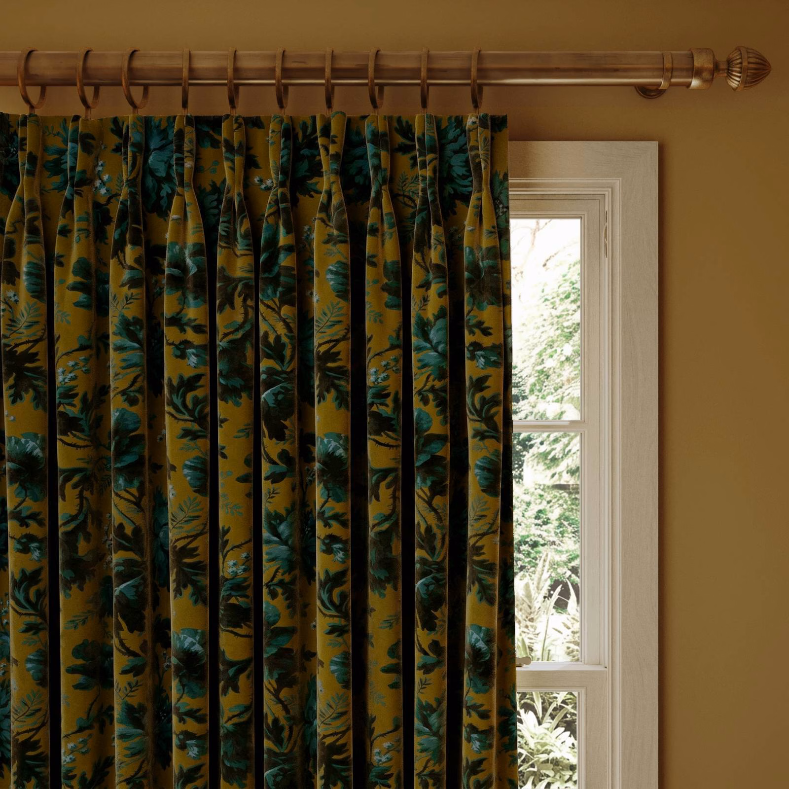 Bronze velvet curtain with teal and deep green botanical foliage in vertical pleats