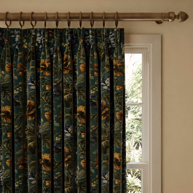 Deep petrol velvet curtains with copper flowers and pale botanical foliage