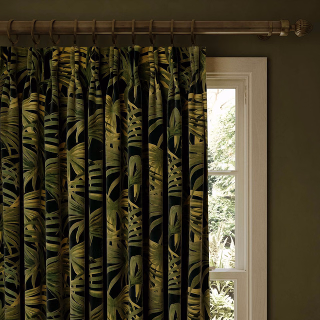 Midnight velvet curtain with layered olive and lime tropical leaves