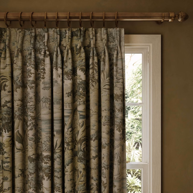Muted sage and olive botanical curtain with softly textured, full pleats