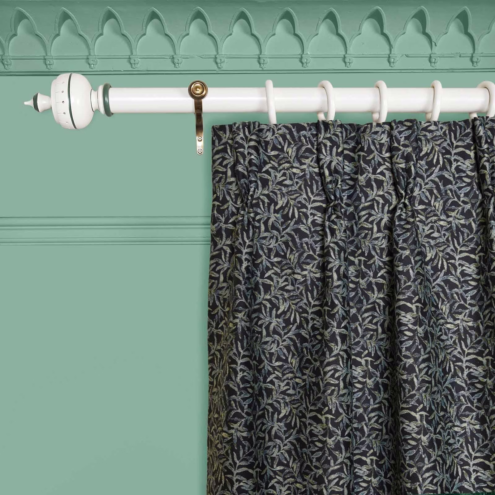 Noir curtain with dense silver-grey and olive leaf jacquard on a black ground