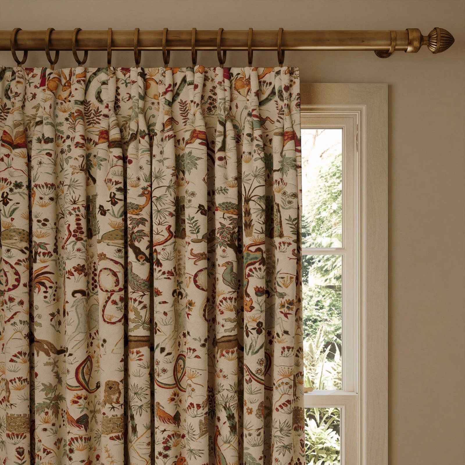Ecru curtain with russet, olive and blue botanical and paisley motifs