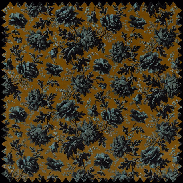 Warm bronze floral ground with charcoal and blue-green blossoms and trailing leaves