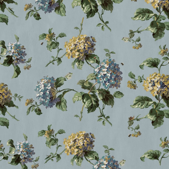 Sky-blue wallpaper with painted blue, yellow and lilac hydrangea clusters and green leaves
