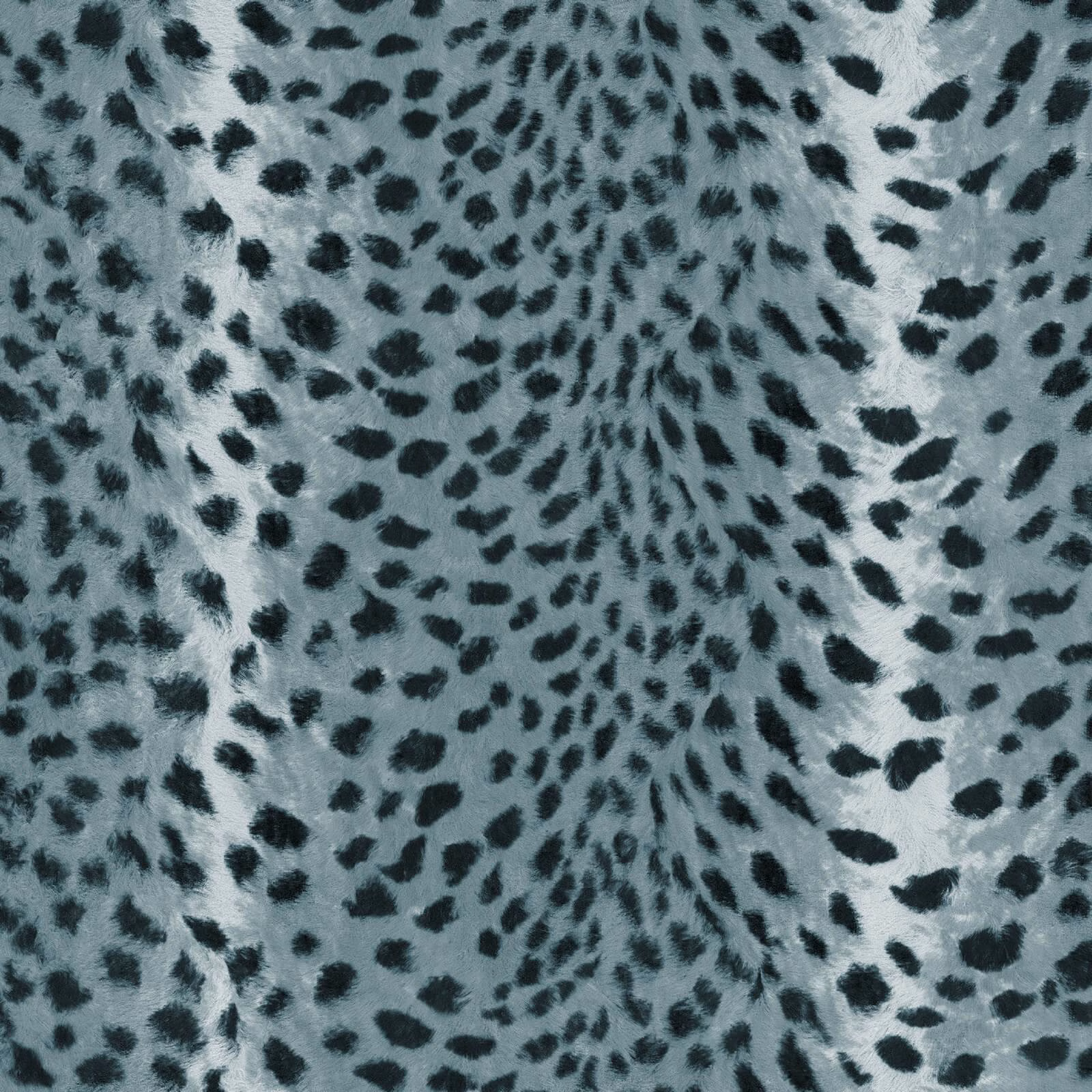 Cool blue-grey wallpaper with black leopard-style spots and a cloudy, mottled ground