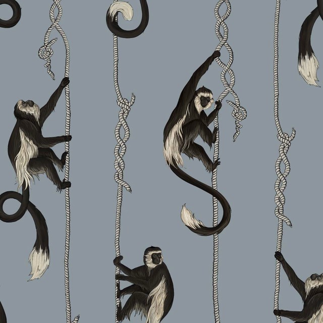 Black and ivory monkeys climbing knotted ropes on a cool blue-grey wallpaper ground