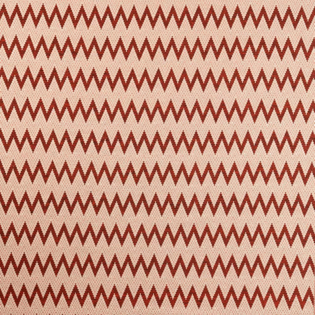 Deep brick-red zigzags repeat across a warm cream, textured woven ground